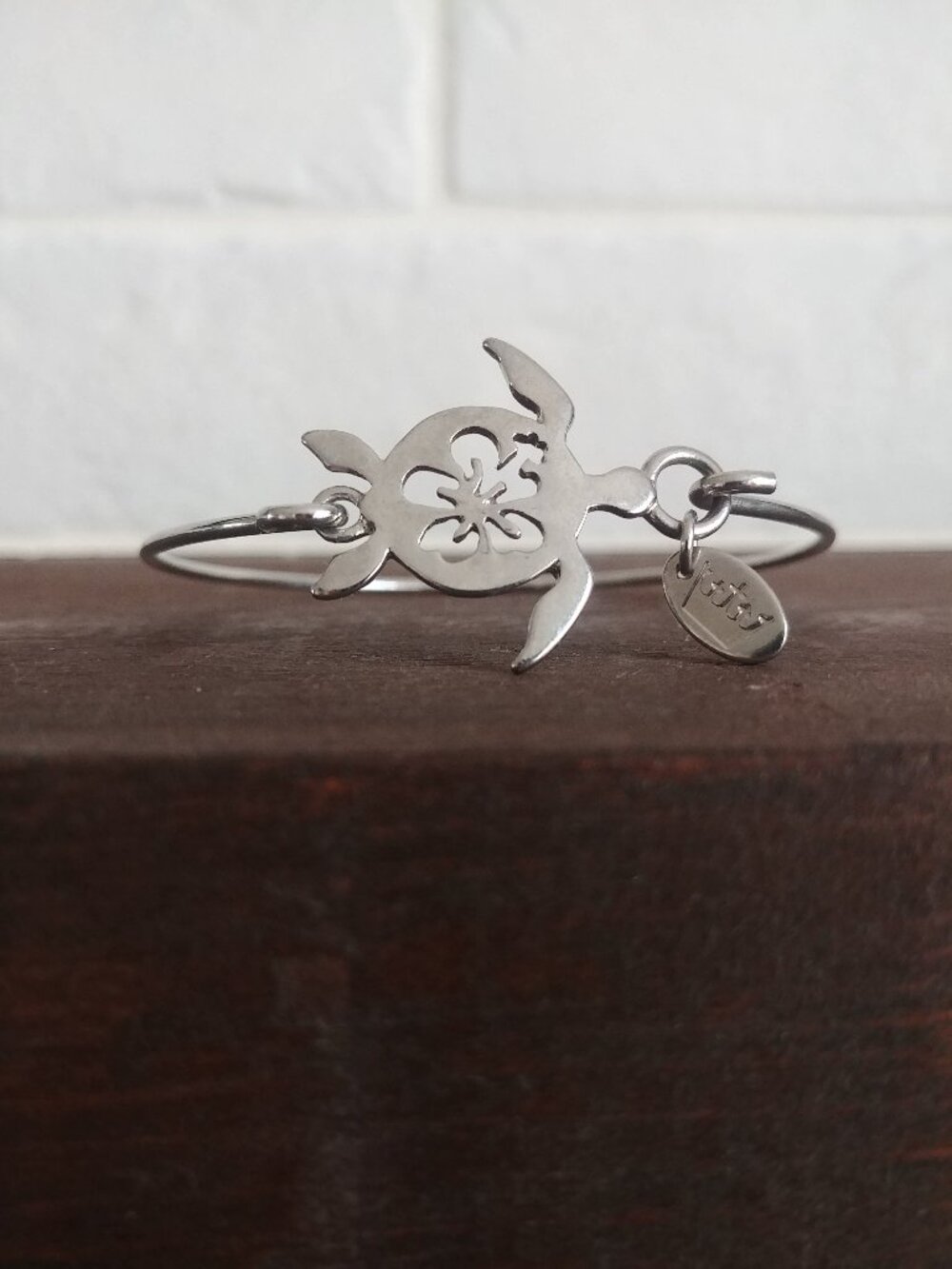 Dainty silver tone turtle and flower cuff bracelet